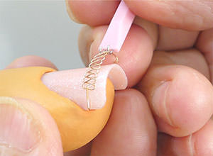 Hook the Block on one side of the nail.